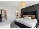 Main bedroom with king bed, en-suite bathroom access, and TV at 2321 Lobelia Dr, Lake Mary, FL 32746