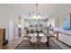 Kitchen and dining area with wood table and white chairs at 2321 Lobelia Dr, Lake Mary, FL 32746