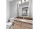 Bathroom with granite vanity and mirrored medicine cabinet at 2626 Raccoon Run Ln, Orlando, FL 32837