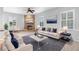 Spacious living room featuring a fireplace and ample natural light at 2626 Raccoon Run Ln, Orlando, FL 32837