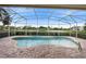 Relaxing kidney-shaped pool with a screened enclosure at 2626 Raccoon Run Ln, Orlando, FL 32837