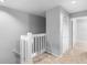Upstairs hall with linen closet and carpet at 2626 Raccoon Run Ln, Orlando, FL 32837