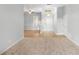 Open living room with neutral carpeting and a view of the entryway at 2626 Raccoon Run Ln, Orlando, FL 32837