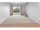 Spacious living room with access to the backyard and pool at 2626 Raccoon Run Ln, Orlando, FL 32837