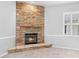 Cozy corner fireplace with stone surround at 2626 Raccoon Run Ln, Orlando, FL 32837