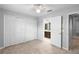 Spacious bedroom with double door closet and carpeting at 2626 Raccoon Run Ln, Orlando, FL 32837