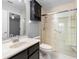 Updated bathroom with walk-in shower and built-in shelving at 2626 Raccoon Run Ln, Orlando, FL 32837