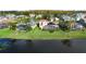 Aerial view of house and neighborhood by the lake at 2626 Raccoon Run Ln, Orlando, FL 32837