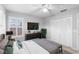 Spacious bedroom with a queen-size bed, large TV, and ample closet space at 2626 Raccoon Run Ln, Orlando, FL 32837