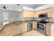 Updated kitchen with granite countertops and stainless steel appliances at 2626 Raccoon Run Ln, Orlando, FL 32837