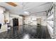 Finished garage with tile floor and shelving at 2626 Raccoon Run Ln, Orlando, FL 32837