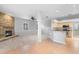 Open living room with fireplace and adjacent kitchen at 2626 Raccoon Run Ln, Orlando, FL 32837