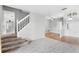 Bright and spacious living room with a staircase leading upstairs at 2626 Raccoon Run Ln, Orlando, FL 32837