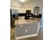 Modern kitchen featuring granite countertops and stainless steel appliances at 3468 Soho St # 107, Orlando, FL 32835