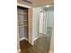 Walk-in hallway closet with ample storage shelving at 3468 Soho St # 107, Orlando, FL 32835