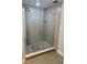Modern shower with glass enclosure and gray tile surround at 3468 Soho St # 107, Orlando, FL 32835