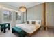 Spacious bedroom with a large bed, modern chandelier, and stylish seating at 5937 High Seas Dr, Orlando, FL 32821