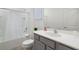 Clean bathroom with a white vanity, shower/tub combo, and gray accents at 5937 High Seas Dr, Orlando, FL 32821