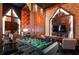 Game room features foosball table and a large TV for gaming and movie nights at 5937 High Seas Dr, Orlando, FL 32821