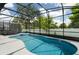 Relaxing pool area with screened enclosure, spa, and lounge chairs at 5937 High Seas Dr, Orlando, FL 32821