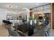 Open concept dining room with large table and modern lighting at 5937 High Seas Dr, Orlando, FL 32821