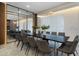Elegant dining room with long table, gray chairs, and modern lighting at 5937 High Seas Dr, Orlando, FL 32821