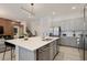Modern kitchen with gray cabinets, white quartz island, and stainless appliances at 5937 High Seas Dr, Orlando, FL 32821
