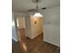 Dining area with hardwood floors and a light fixture at 6008 Village Cir # Ge, Orlando, FL 32822