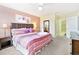 Spacious bedroom with a comfortable king-size bed and an ensuite bathroom at 1423 Thunderbird Rd, Davenport, FL 33896