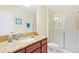 Bathroom with a large walk-in shower and granite countertop at 1423 Thunderbird Rd, Davenport, FL 33896