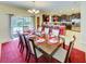 Bright dining room with a large table and kitchen views at 1423 Thunderbird Rd, Davenport, FL 33896