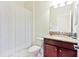 Small bathroom with shower/tub combo, granite countertop, and colorful shower curtain at 1423 Thunderbird Rd, Davenport, FL 33896
