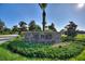 Stone entrance sign for the Plaza community with landscaping at 1490 Olympic Club Blvd, Champions Gate, FL 33896