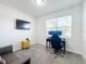Home office featuring a desk, comfortable chair, and large window for natural light at 1490 Olympic Club Blvd, Champions Gate, FL 33896