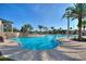 Relaxing community pool with a waterfall feature at 1490 Olympic Club Blvd, Champions Gate, FL 33896