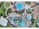 Aerial view of community with multiple pools and landscaping at 1490 Olympic Club Blvd, Champions Gate, FL 33896