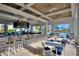 Covered outdoor bar and lounge area with pool views at 1490 Olympic Club Blvd, Champions Gate, FL 33896