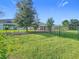 Large backyard with grassy area and privacy fence at 1490 Olympic Club Blvd, Champions Gate, FL 33896