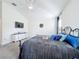 Spacious bedroom with large bed, dresser, and mounted TV at 1490 Olympic Club Blvd, Champions Gate, FL 33896