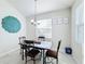 Cozy dining area with a metal table and four chairs, perfect for Gathering meals at 1490 Olympic Club Blvd, Champions Gate, FL 33896