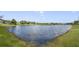 Scenic view of a tranquil lake within a residential community at 2018 Bayside Ave, Mount Dora, FL 32757