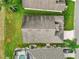 Aerial view of a single-Gathering home with a pool and landscaped yard at 235 Royal Palm Dr, Davenport, FL 33837