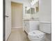 Clean bathroom with white vanity and toilet at 235 Royal Palm Dr, Davenport, FL 33837