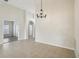Bright dining room with tile floors and chandelier at 235 Royal Palm Dr, Davenport, FL 33837