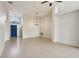 Large living room with tile floors and high ceilings at 235 Royal Palm Dr, Davenport, FL 33837