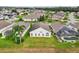 Aerial view of houses in a neighborhood with lush landscaping at 235 Royal Palm Dr, Davenport, FL 33837