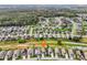 Aerial view of a residential community, highlighting a specific property at 235 Royal Palm Dr, Davenport, FL 33837