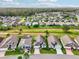 Aerial view of community, showcasing numerous homes and green spaces at 235 Royal Palm Dr, Davenport, FL 33837
