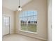 Bright breakfast nook features a large arched window and tile flooring at 235 Royal Palm Dr, Davenport, FL 33837