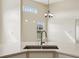 Modern kitchen sink and countertop with a sleek faucet at 235 Royal Palm Dr, Davenport, FL 33837